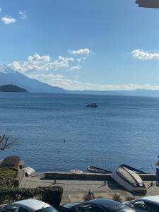 a large body of water with a boat in it at Bilyana Apartments in Ohrid