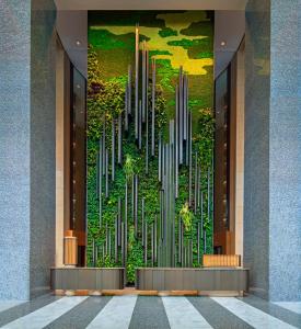 a wall mural in a lobby of a building at PARKROYAL COLLECTION Marina Bay, Singapore in Singapore