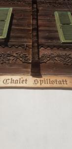 a cake with the words chittriftrift on the top of a table at Chalet Spillstatt in Grindelwald