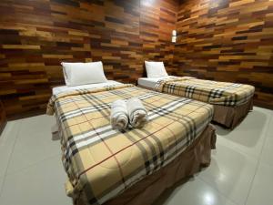 Cama o camas de una habitación en โรงแรมภูน้ำฟ้า - Phunumfha Hotel ชุมแพ