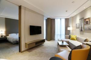 En TV eller et underholdningssystem på Hyatt House Shanghai Hongqiao CBD