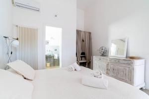 Katil atau katil-katil dalam bilik di Masseria San Martino