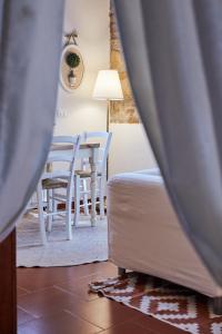 A bed or beds in a room at La Panoramica Gubbio - Maison de Charme - Casette e appartamenti self catering per vacanze meravigliose!