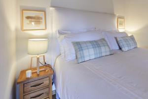 A bed or beds in a room at La Panoramica Gubbio - Maison de Charme - Casette e appartamenti self catering per vacanze meravigliose!