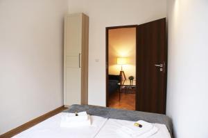 Posteľ alebo postele v izbe v ubytovaní Classic apartments Pilsudskiego street