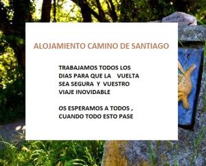 a sign with a picture of a squirrel on a rock at Piso Camino De Santiago in Sarria