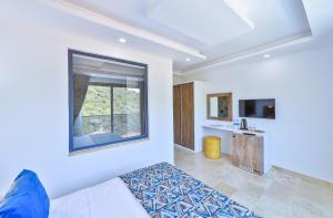 TV a/nebo společenská místnost v ubytování Villa Kas Bohem