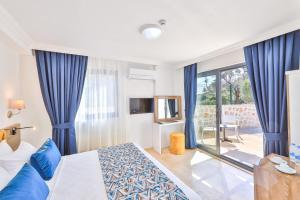 Postel nebo postele na pokoji v ubytování Villa Kas Bohem + 38 fotografií