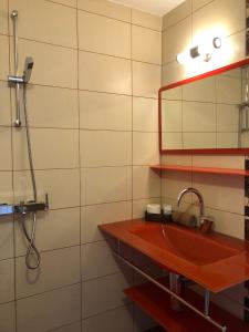a bathroom with a sink and a shower at Hotel Silver in Sozopol