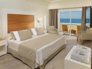a bedroom with a large bed with a view of the ocean at XQ El Palacete in Morro del Jable +37 photos