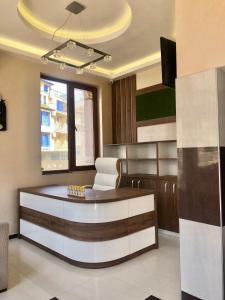 a office with a desk and a chair in a room at Hotel Silver in Sozopol