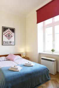 Posteľ alebo postele v izbe v ubytovaní Classic apartments Pilsudskiego street