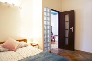 Posteľ alebo postele v izbe v ubytovaní Classic apartments Pilsudskiego street