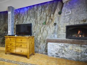 A television and/or entertainment centre at Chalet in La Omañuela near Ski Resort