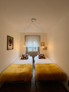 Postel nebo postele na pokoji v ubytování Sintra Centro Apartment