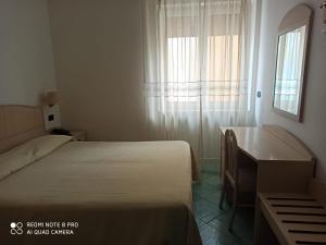 Кровать или кровати в номере La Residenza Aparthotel