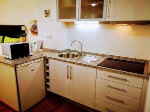 A cozinha ou kitchenette de Casa dos Avós Apartments