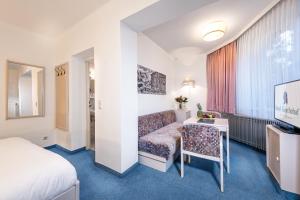 Postel nebo postele na pokoji v ubytování Hotel Goethehof