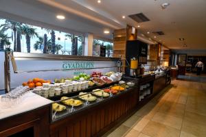 a buffet line in a hotel with food on display at Gran Hotel Guadalpín Banus in Marbella