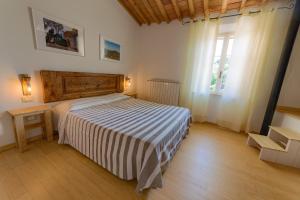 A bed or beds in a room at Agriturismo Podere Carducci