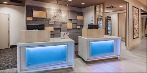 a lobby with two large aquariums in a building at Holiday Inn Express & Suites - Madison West - Middleton, an IHG Hotel in Middleton