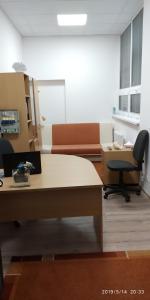 an office with a desk and a chair and a table at WHITE CORAL CLUB in Košice