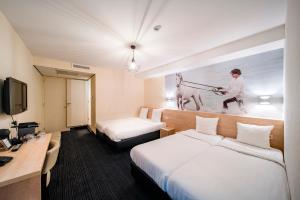 Tempat tidur dalam kamar di Hotel Iron Horse Amsterdam