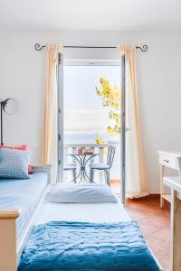 Postel nebo postele na pokoji v ubytování Sutivan Best Apartments