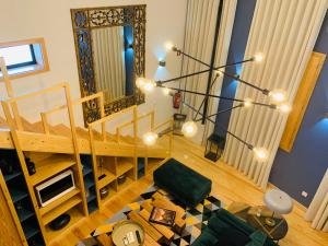 an overhead view of a living room with a staircase at L'atelier Apartments (Pintura) in Guimarães