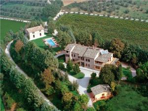 an aerial view of a house with a swimming pool at Podere Caldaruccio La Pineta in Bosco