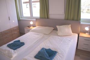 Posteľ alebo postele v izbe v ubytovaní Appartements Bleistattblick