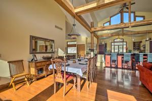 a dining room with a table and a kitchen at Country Villa on Kalamalka Lake with Pool! in Oyama