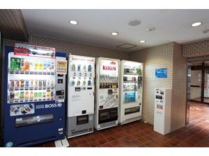 a gas station with three machines in a room at Sky Heart Hotel Kawasaki / Vacation STAY 80809 in Kawasaki