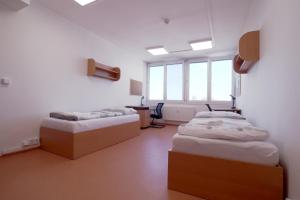 Letto o letti in una camera di Domov mládeže - Ubytování Sokolov