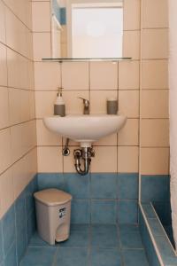 a bathroom with a sink and a toilet at Best House, Nirvana II, Patra in Patra