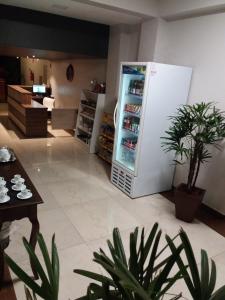 a kitchen with a refrigerator with drinks in it at Sleep Hotel in Toledo