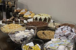 a table topped with lots of different types of desserts at Sleep Hotel in Toledo