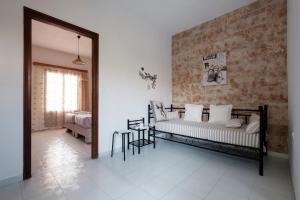 a bedroom with two beds and a mirror at Hotel Club Maria Sidari in Sidari
