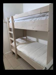 a couple of bunk beds in a room at Bungalow 72 in Exloo