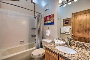 a bathroom with a sink and a toilet and a tub at 2 Mi to Park City Mtn Townhome with Balcony in Park City +16 photos