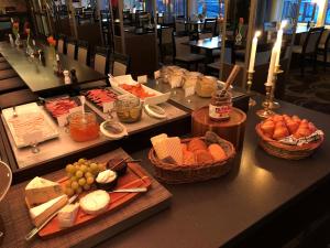 a buffet of food on a table in a restaurant at Hotell Valhall in Kalix