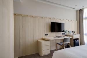 Μια τηλεόραση ή/και κέντρο ψυχαγωγίας στο Jasper Young Hotel Banqiao