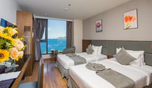Un ou plusieurs lits dans un hébergement de l'établissement DTX Hotel Nha Trang