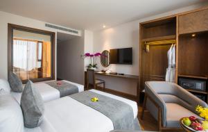 Télévision ou salle de divertissement dans l'établissement DTX Hotel Nha Trang