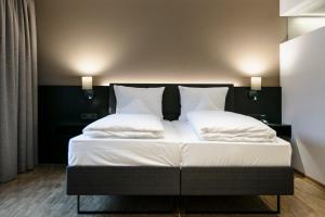 Letto o letti in una camera di Montfort - das Hotel