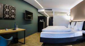 Letto o letti in una camera di Montfort - das Hotel