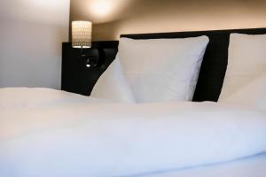 Letto o letti in una camera di Montfort - das Hotel