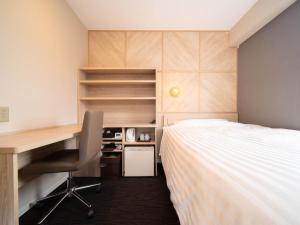 Voodi või voodid majutusasutuse Super Hotel Nagaizumi Numazu Inter toas
