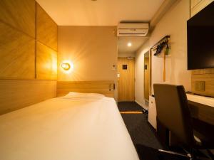 Voodi või voodid majutusasutuse Super Hotel Nagaizumi Numazu Inter toas