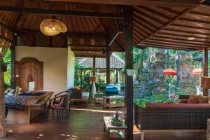 A seating area at Adiwana Svarga Loka - A Retreat Resort